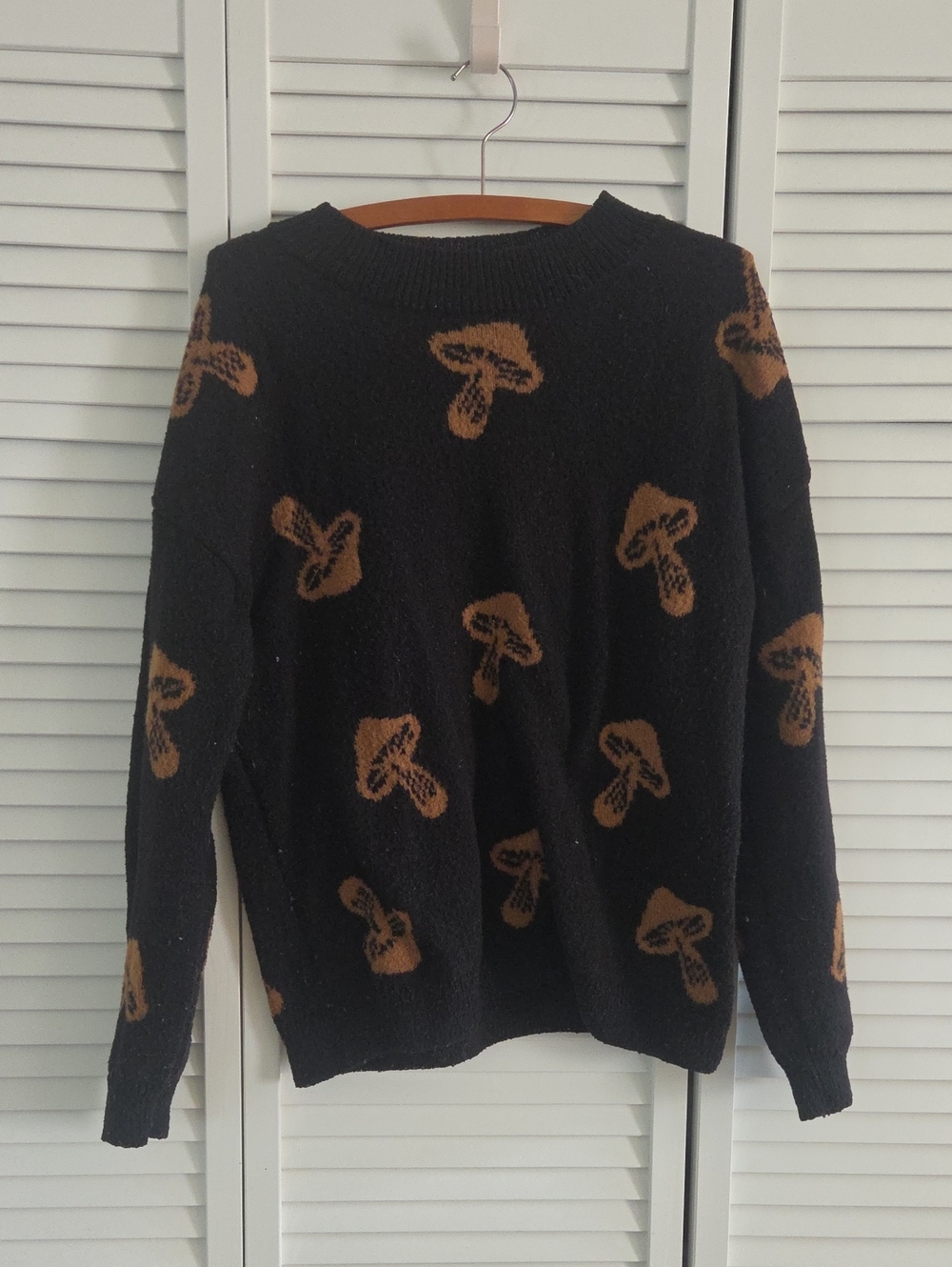 No Boundaries Black Crewneck Sweater with Brown Mushroom Pattern